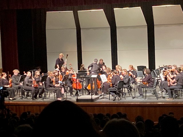 A picture of the Bellingham Intermediate Orchestra getting ready to preform