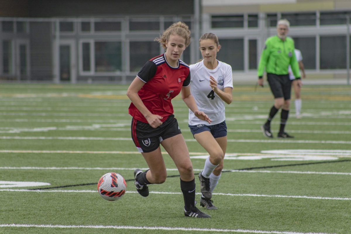 Genevieve Blum protects the ball from Squalicum High School. 