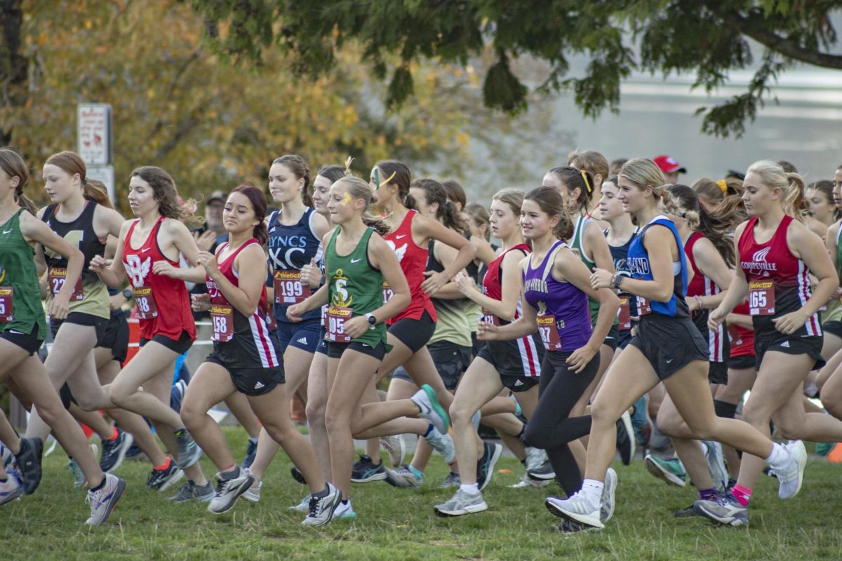 The girls cross country team starts their race.