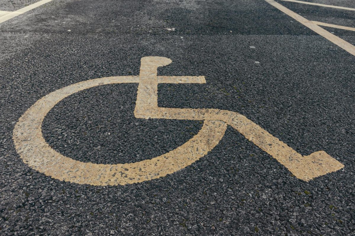 Photo by Jakub Pabis: https://www.pexels.com/photo/painted-disability-icon-on-pavement-11074335/