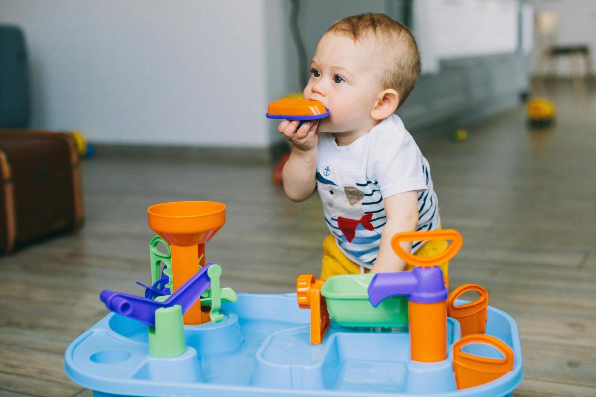 Kid chewing on toy