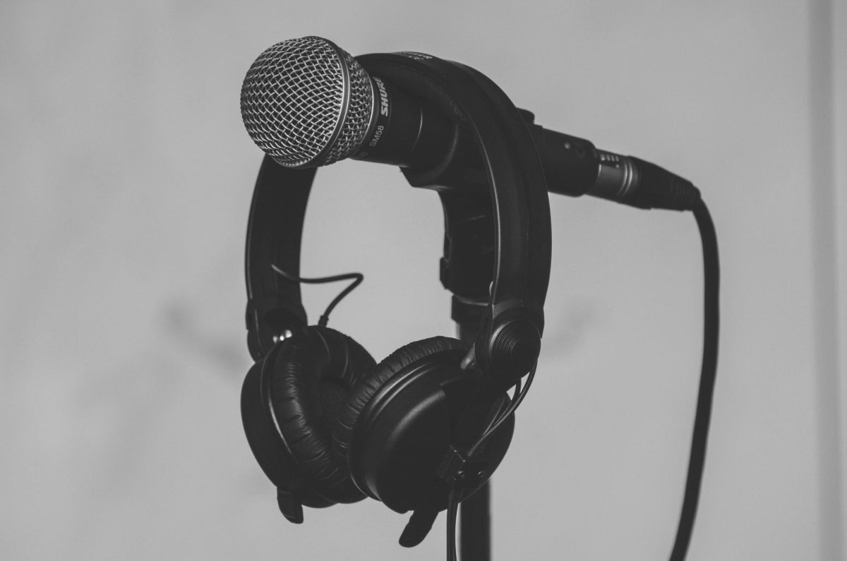 Set of headphones hung on a microphone stand